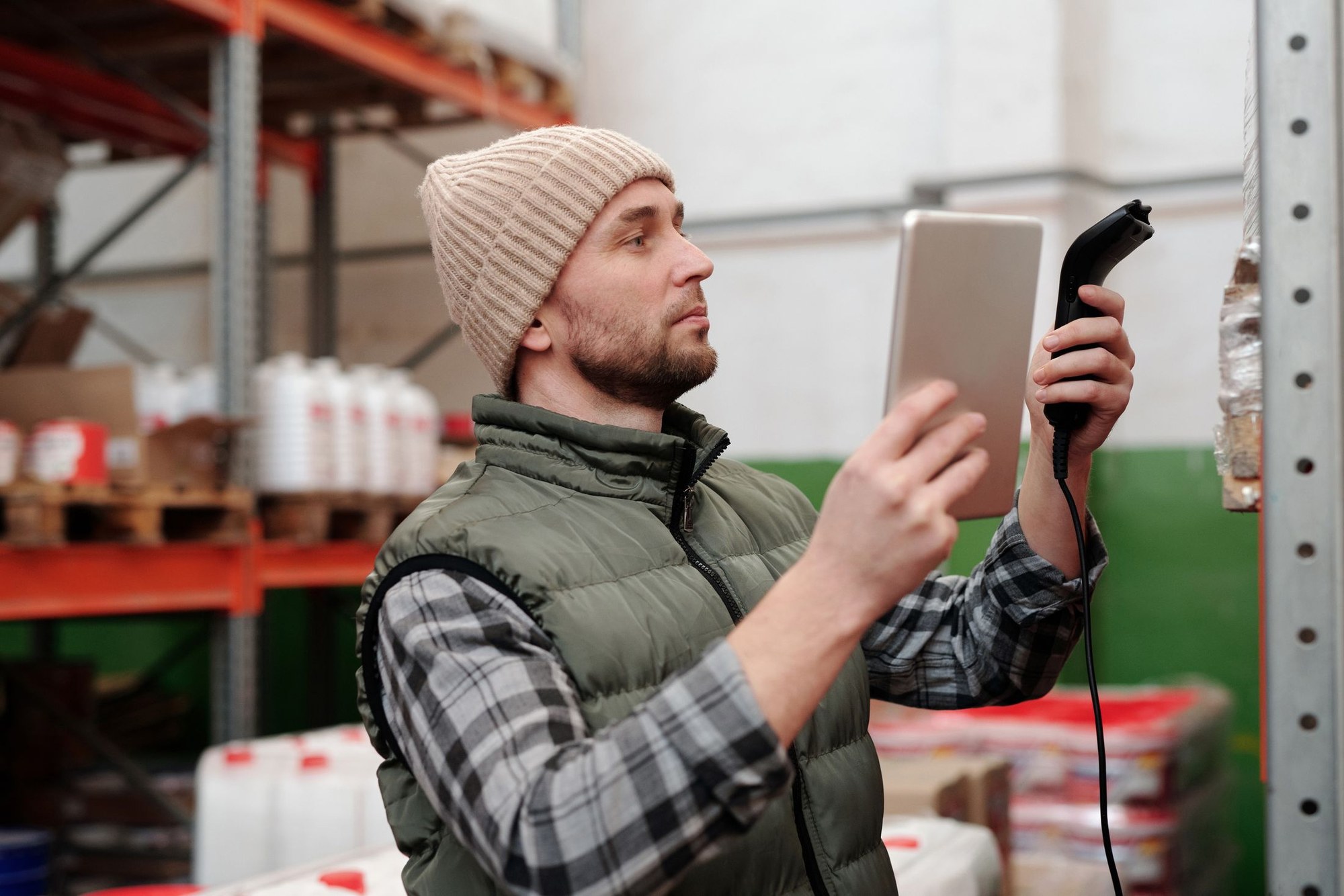 Warehouse employee checking goods